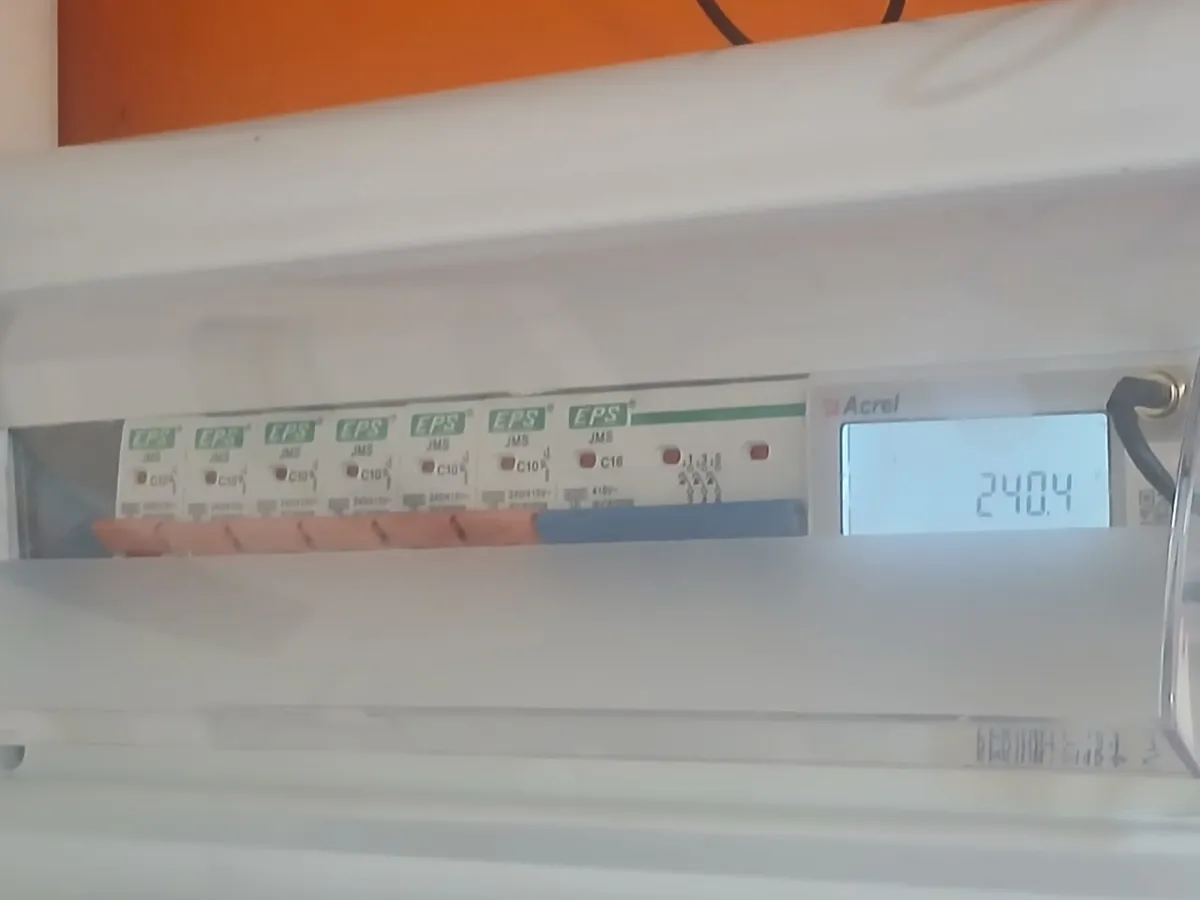 Acrel ADW300W installed alongside the circuit breakers, showing a live 240.4 V reading.